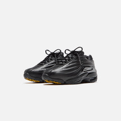 Nike x NOCTA Hot Step 2 - Black / Gunmetal / University Gold | Kith Black / Gunmetal / University Gold