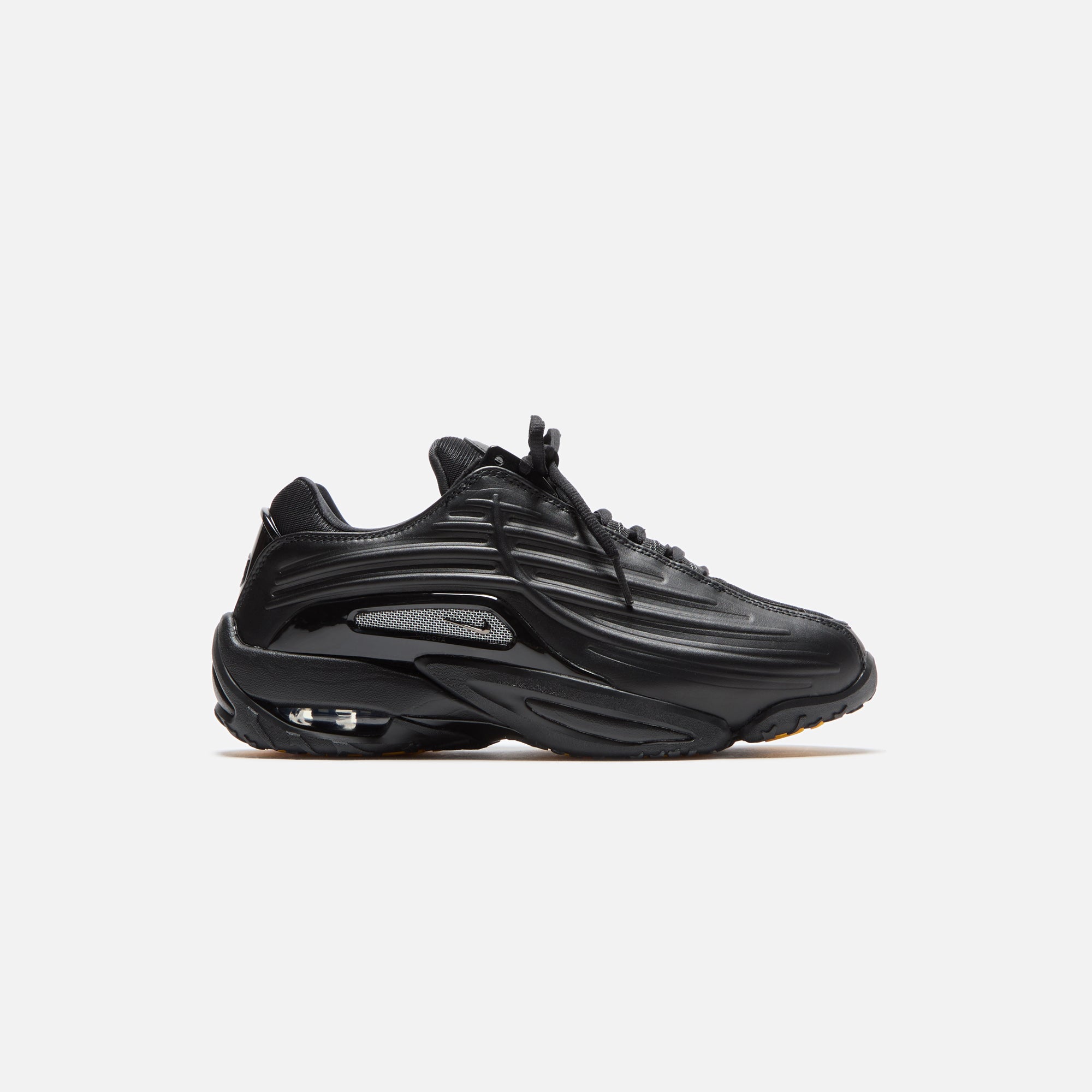 Nike x NOCTA Hot Step 2 - Black / Gunmetal / University Gold | Kith Black / Gunmetal / University Gold