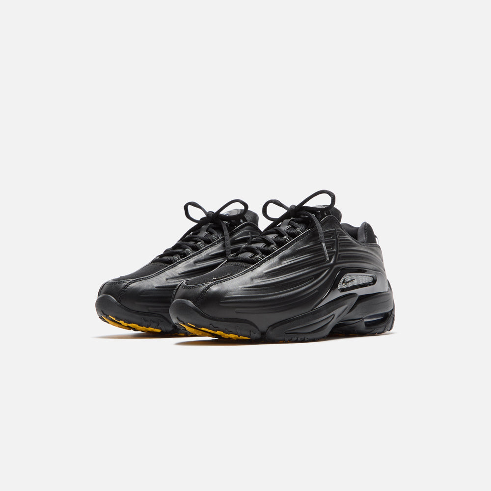 Nike x NOCTA Hot Step 2 - Black / Gunmetal / University Gold | Kith Black / Gunmetal / University Gold