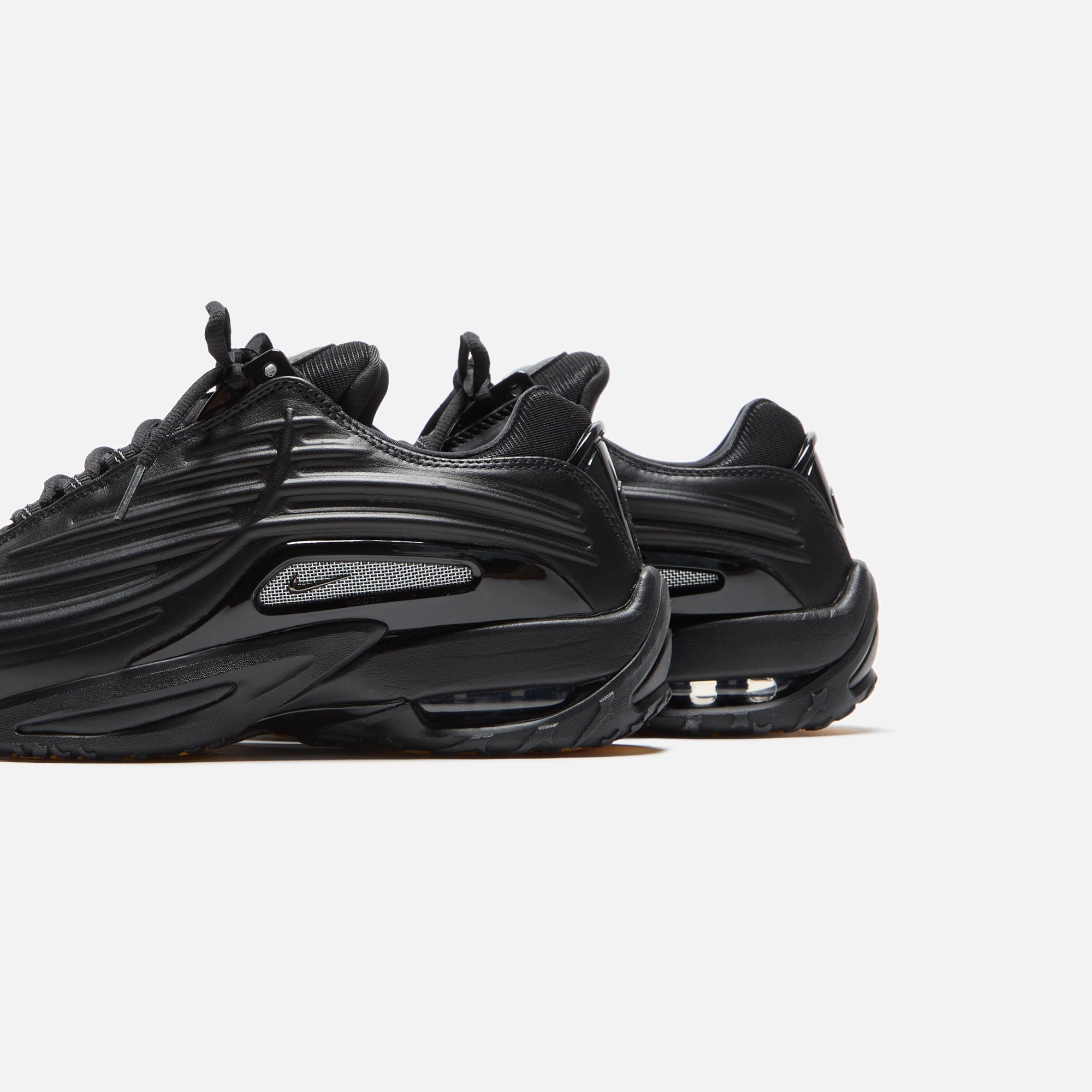 Nike x NOCTA Hot Step 2 - Black / Gunmetal / University Gold | Kith Black / Gunmetal / University Gold